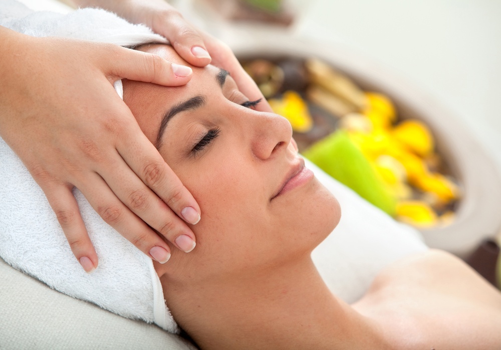 Woman at a spa having a massage in her face